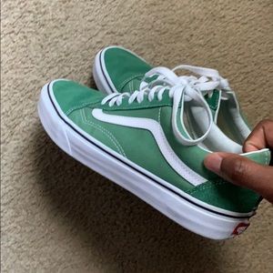Green and white vans